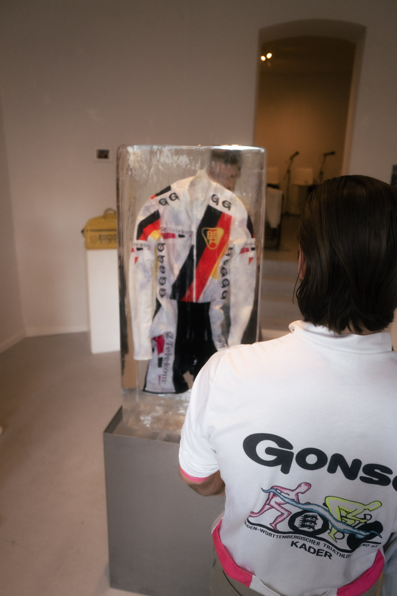jacket, cycling jacket, logo patch, white jacket, display case